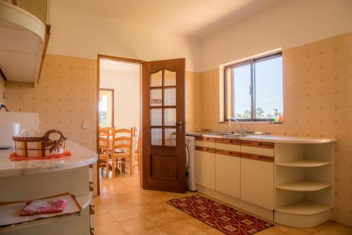 a kitchen with a sink and a window at D05 - Amadeus Sunset Villa in Mato Porcas