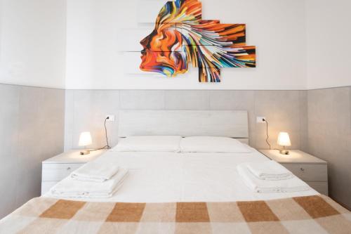 a bedroom with a bed with a painting of a horse at 59 Tourist House Bologna Lame - Self check-in in Bologna