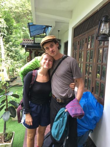a man and a woman standing next to a house at Villa25 Homestay free pick up from the centre in Kandy
