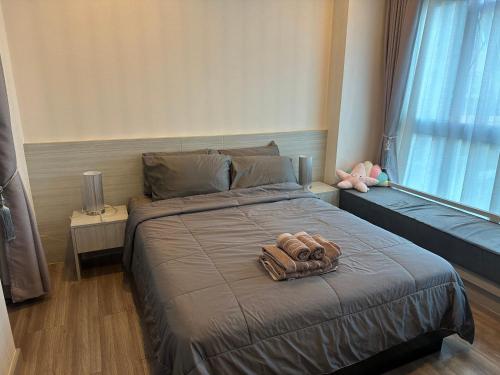 Postel nebo postele na pokoji v ubytování The prio apartment chiangmai airport