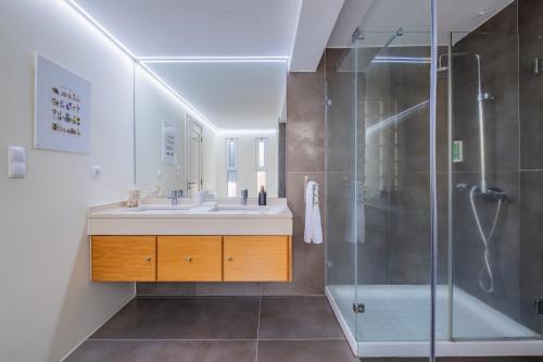 a bathroom with a sink and a shower at Beach House in Santa Cruz