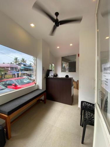 an office with a ceiling fan and a desk at REGAL SUITES in Trivandrum