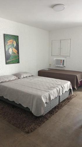 a bedroom with a large bed in a room at Casa da Lu - PRAÇA DO CARMO OLINDA in Olinda