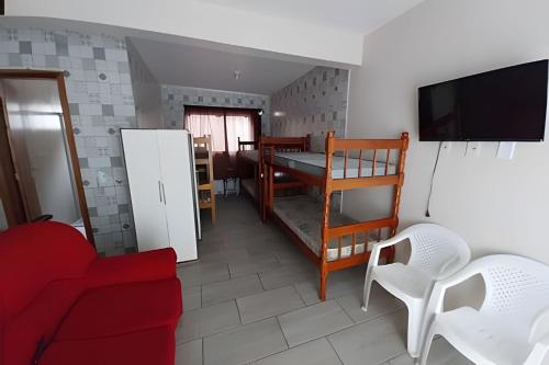 Ένα ή περισσότερα κρεβάτια σε δωμάτιο στο Apartamentos em SC