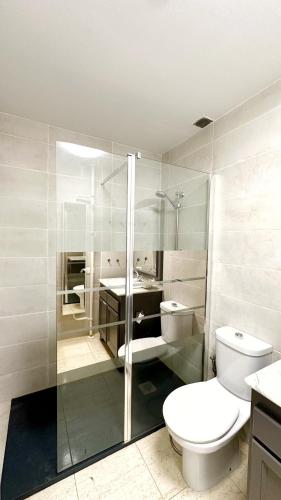 a bathroom with a toilet and a shower and a sink at Caroline del Mar - Nudist Naturist in Vera