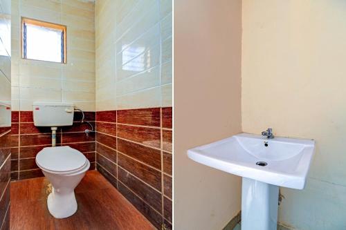 a bathroom with a toilet and a sink at SPOT ON Shreekrupa in Mahabaleshwar