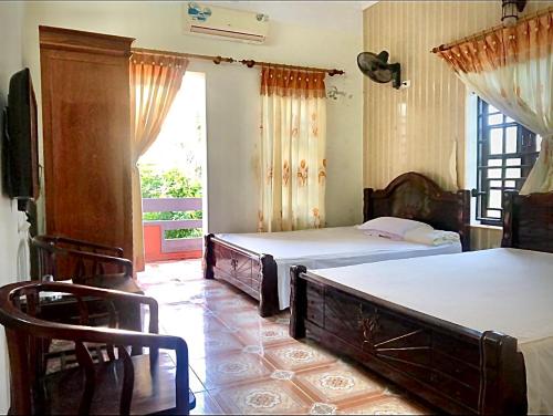 Ένα ή περισσότερα κρεβάτια σε δωμάτιο στο HaiAu Hotel