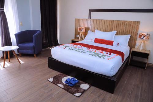 A bed or beds in a room at Fenet Hawassa Hotel