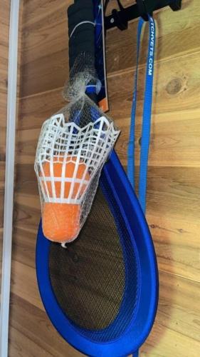 a tennis racket with a net on the floor at Mountain View #615 in Whittier