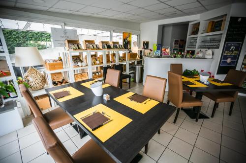a restaurant with tables and chairs in a room at Albergo Italia in Porto Tolle