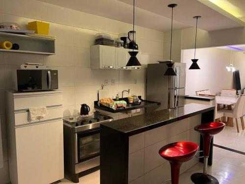 Virtuvė arba virtuvėlė apgyvendinimo įstaigoje Casa aluguel Emissario Arembepe