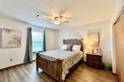 a bedroom with a bed and a ceiling fan at Charming remodeled 2 bed GEM Middletown in Middletown