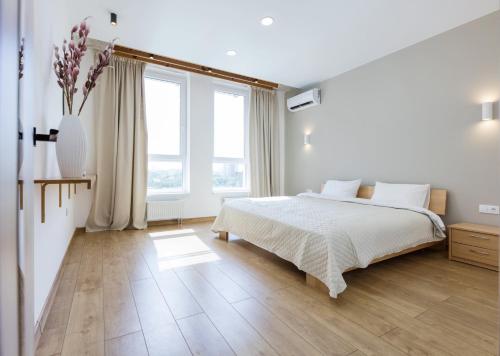 Ένα ή περισσότερα κρεβάτια σε δωμάτιο στο Nyvky Like Home - Nyvky Park - apt 45