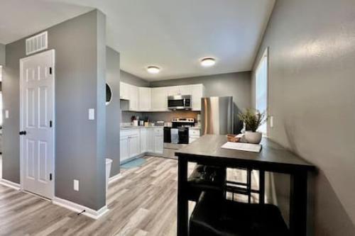 a kitchen with a table and a counter top at Charming, Stylish remodeled Trenton Apartment in Trenton