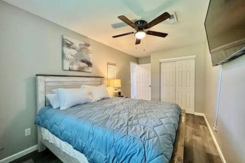 a bedroom with a bed with a ceiling fan at Remodeled 2 BDRM Ranch Attached Home Liberty, TWP in Rockdale