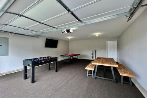 a room with a ping pong table and a ping pong table at Brand New Home Walking distance to Spooky Nook in Hamilton