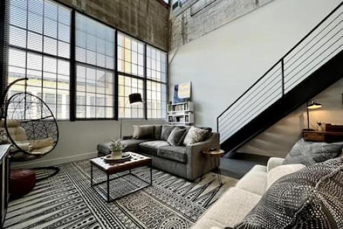 a living room with a couch and a table at 5104 Cartridge Factory Loft in Maineville