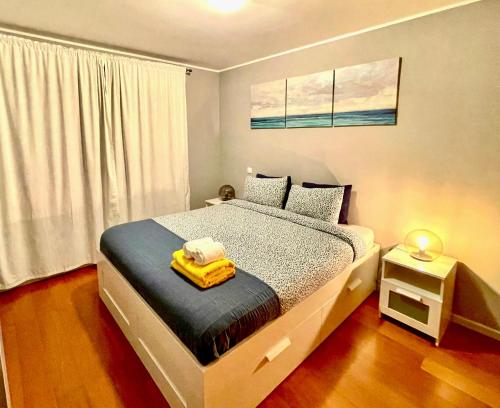 Un pat sau paturi într-o cameră la Porto Cozy House