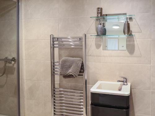 a bathroom with a shower and a sink at Sunnyside in Barrow upon Humber