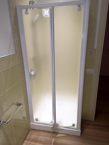 a shower with a glass door in a bathroom at Locanda LaRotonda in Villa Verucchio