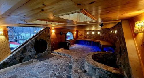 an overhead view of a room with a stone wall at White Lotus Suite in Stanardsville