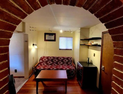 a bedroom with a bed and a table in a room at Royal Suite at White Lotus Eco Spa Retreat in Stanardsville