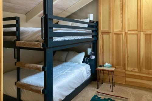 a bunk bed in a room with a bunk bed in a house at Yampa View 307 in Steamboat Springs