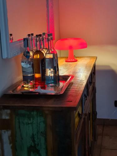 a counter with bottles of alcohol on a tray at Manfredi ristorante con alloggio in Romentino