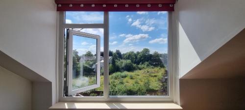 an open window with a view of a forest at Do not book, property being removed from site in Manchester