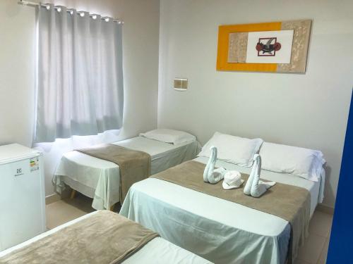 Ένα ή περισσότερα κρεβάτια σε δωμάτιο στο Atalaia VIP Praia Hotel