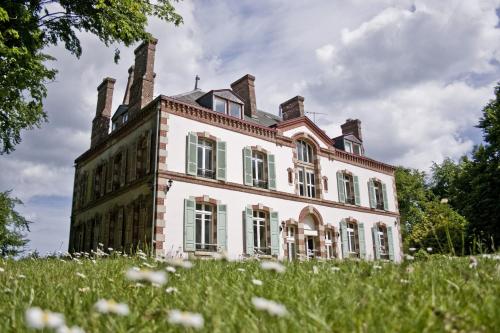 an old house on top of a grassy hill at Domaine de Keravel in Plouha