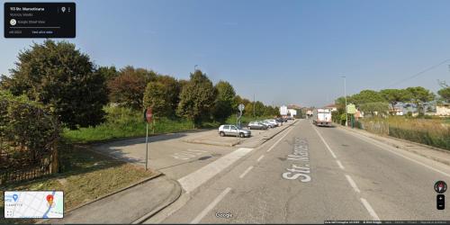 an empty road with cars parked on the side of the road at Lavanda House in Vicenza