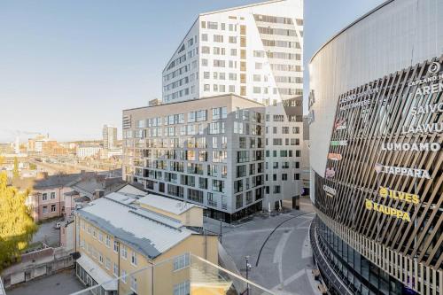 an aerial view of a city with tall buildings at Tampere City view near Nokia Arena AC in Tampere
