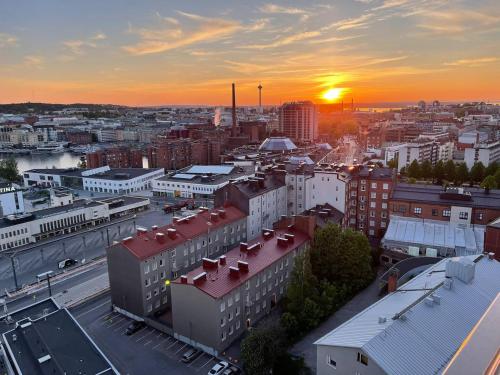 an aerial view of a city at sunset at Tampere City view near Nokia Arena AC in Tampere