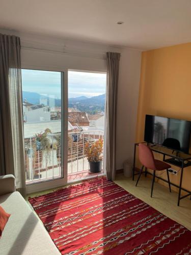 TV a/nebo společenská místnost v ubytování La Casa Alhambra