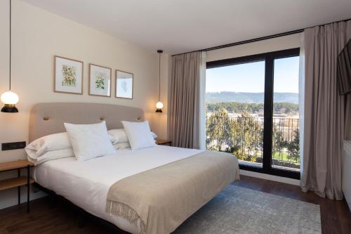 Posteľ alebo postele v izbe v ubytovaní Duruelo Mountain Suites