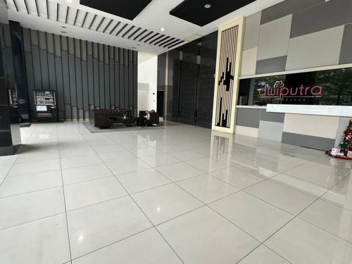 a large lobby with a large white tiled floor at Casa Budi Dwiputra 15 Putrajaya in Putrajaya