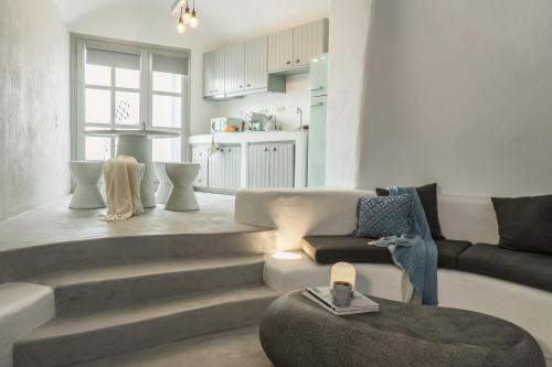 a living room with a staircase leading to a kitchen at Yposkafon Concept Two-Bedroom Villa with Private Jacuzzi and Hamam in Megalokhori