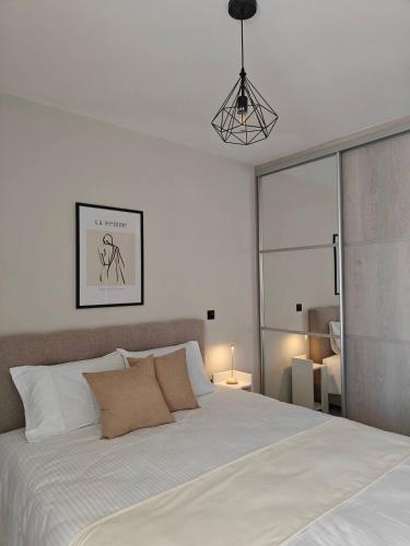 Ένα ή περισσότερα κρεβάτια σε δωμάτιο στο Orchidea Flat