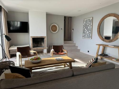 a living room with a couch and a table at Finca Vista in Marbella