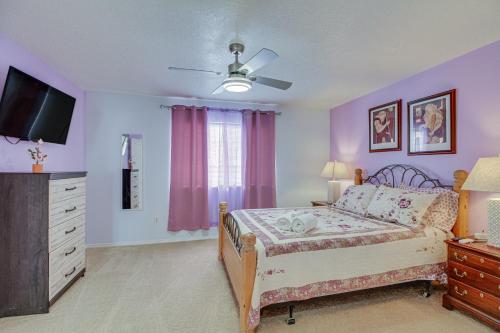 a bedroom with a bed with a dresser and a tv at Albuquerque Getaway Near Shopping and Fiesta Park! in Albuquerque