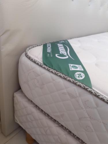 a mattress with a green and white tag on it at Ayres Apart in Chivilcoy