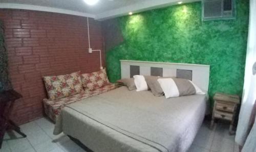 Ένα ή περισσότερα κρεβάτια σε δωμάτιο στο A Ilha Verde Hotel Pousada na Praia