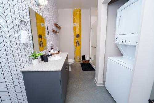 a bathroom with a sink and a toilet at Cozy Luxurious Loft in Downtown Memphis in Memphis