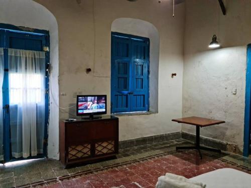 TV a/nebo společenská místnost v ubytování Casa Hacienda Estrada