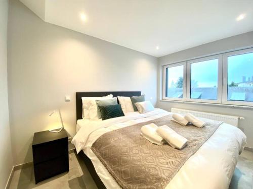 En eller flere senge i et værelse på Two bedrooms in Limpertsberg