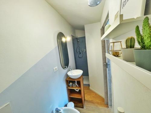 a bathroom with a sink and a toilet in it at BeHappyS Deluxe Apartment-Charming Balcony in Bologna