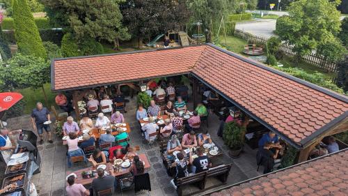 an overhead view of a group of people sitting at a restaurant at Cafe zum Toni in Thyrnau
