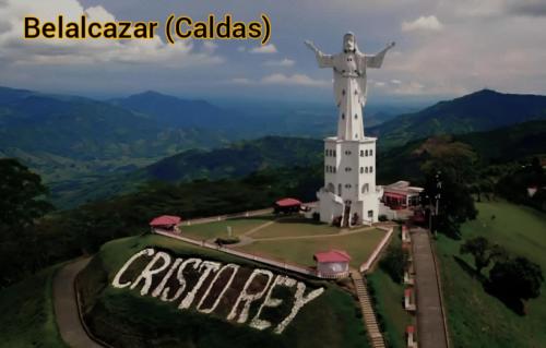 a statue of a christ redeemer on top of a hill at MUNAY, Posada rural para el sosiego in Alcalá