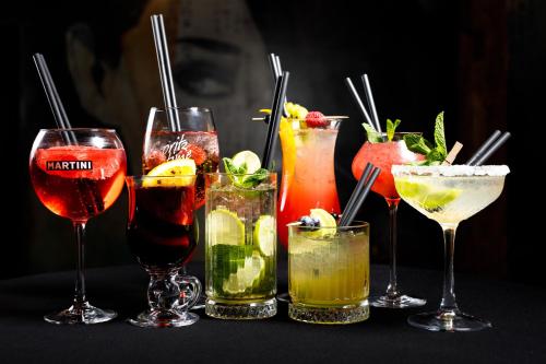a group of different types of drinks on a table at Hotel Węgierki in Września